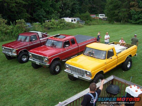 Yellow Ford pickup truck, front 3/4 view, lifted