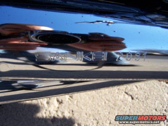 Chrome exhaust pipe with "SANKEI 2037" text
