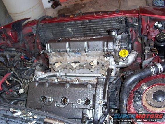 1996 Ford Probe engine bay with exposed engine components and radiator