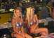 2004 Yamaha PZ500 Phazer - Two women in patriotic bikinis pose at a vendor table, with merchandise displayed in the background.