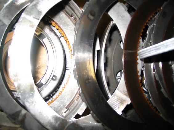 Transmission clutch pack with visible rust on friction plates