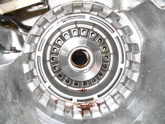 Transmission torque converter housing with splined input shaft opening