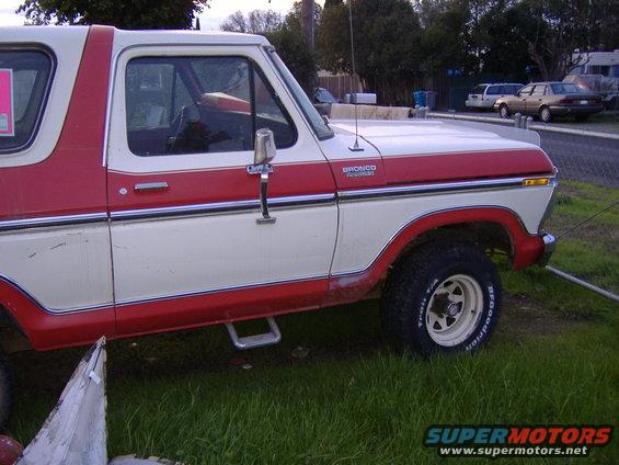 Red and white 1978 Ford Bronco side view with "BRONCO Ranger" badging