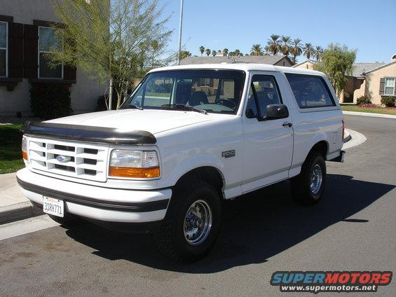 White 1996 Ford Bronco parked on a residential street