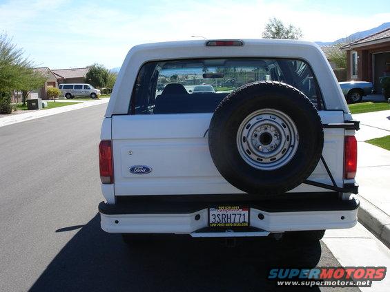 White 1996 Ford Bronco rear view with spare tire mounted on the back