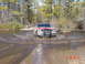 1995 Dodge 1500 - This red 1995 Chevrolet K1500 navigates a muddy water crossing.