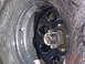 1995 Dodge 1500 - A close-up view of a vehicle's wheel hub and tire, covered in water droplets.