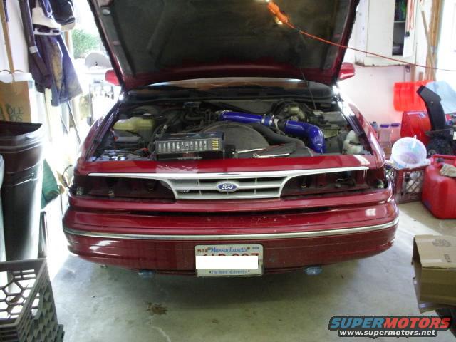 1995 Ford Crown Victoria front view, hood open showing engine bay. Massachusetts license plate visible