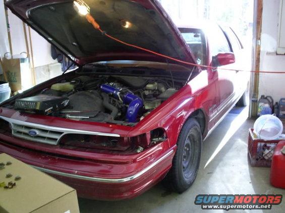 Red 1995 Ford Crown Victoria front view with hood open