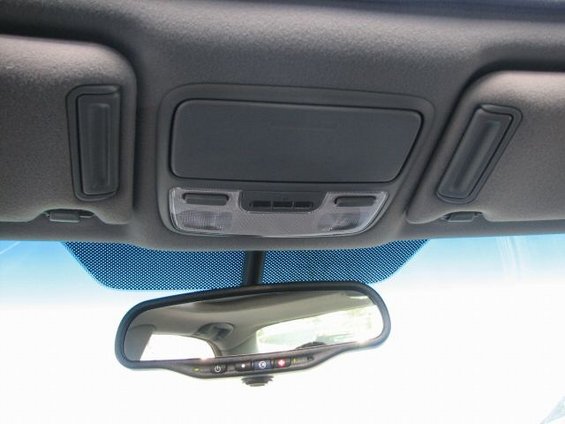 Interior overhead console with lights and storage, and rearview mirror with buttons