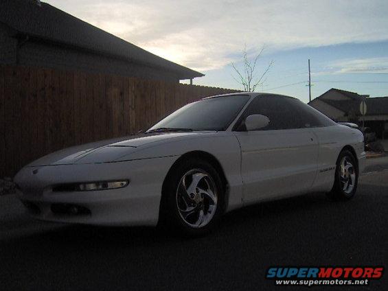 White 1996 Ford Probe parked outside a house