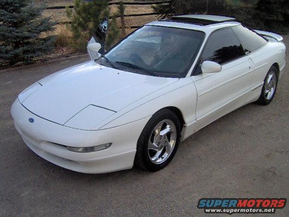 White 1996 Ford Probe parked outside