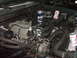 1994 Ford F-150 - The engine bay of a 1994 Ford F-150 contains several cans of beer.