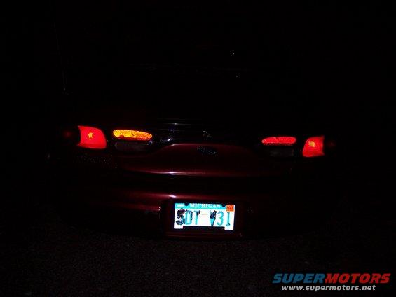 1999 Ford Taurus rear with taillights on and Michigan license plate 5DT Y31