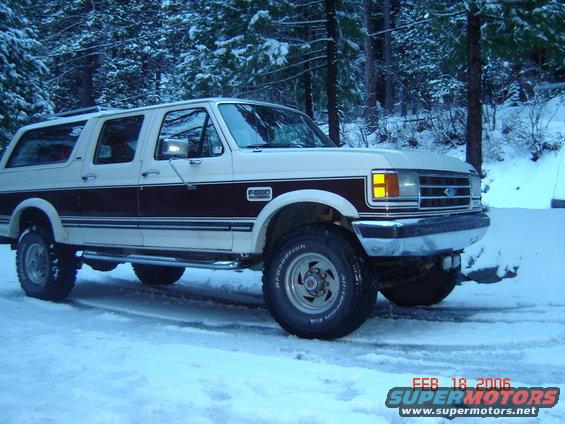1990 Ford C-350 Centurion Conversions SUV in snow