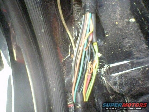 Tangled, frayed wires from a vehicle's wiring harness