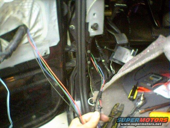Interior wiring harness with colorful wires being worked on