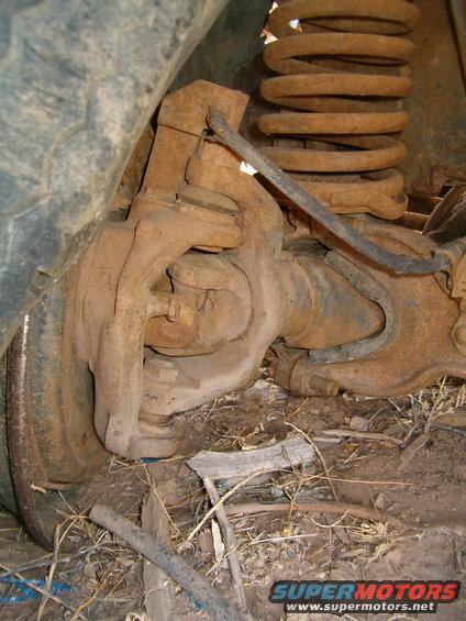 Front axle and rusty coil spring