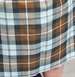 1990 Ford Bronco - Fabric with a plaid pattern in brown, white, and gray tones.