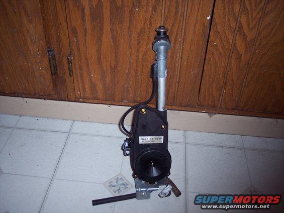 Black power antenna assembly with metal mast and mounting bracket, label reads 'KASTO RR 9309'