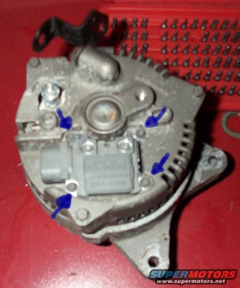 voltageregscrews.jpg Remove the 4 screws that the blue arrows point too. (T20 torx bit)