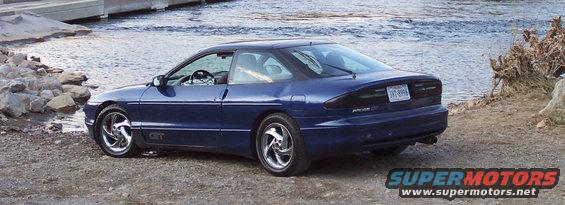Blue 1994 Ford Probe GT parked by water, rear 3/4 view