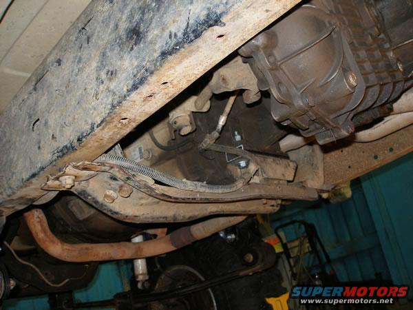 p1050022.jpg The drive line hit the crossmember.  No fancy loop or modification is needed.  All I did is drop the crossmember underneith the frame and add 1" spacer to the mount.  I wasn't sure if I would be using this crossmember in the future anyway.