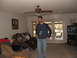 1966 Ford Ranchero - Several people are gathered in a living room, with one man standing and holding a blue cup.