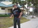 1966 Ford Ranchero - A man stands outside a building with palm trees in the background.