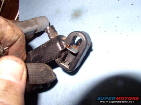 img_0014.jpg Like anything set into plastic, the metal spring has a detent to allow removal of the spring. I used a tiny screwdriver to depress the tang/detent and the spring pushed out no trouble.