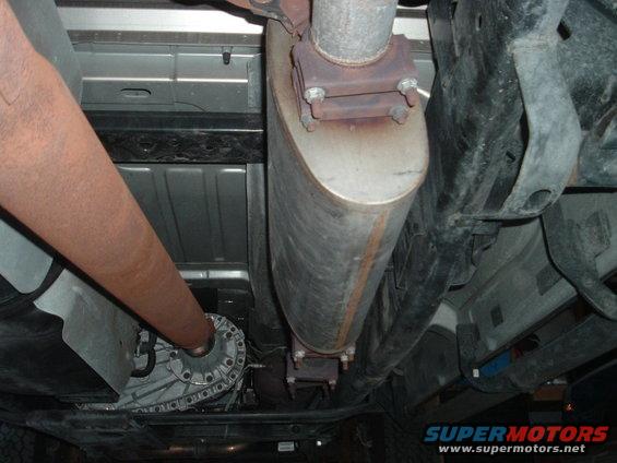 Just underneath.  Ya can see the magnaflow muffler and anythin; else that suits your fancy.  That driveshaft ain't the best lookin'.