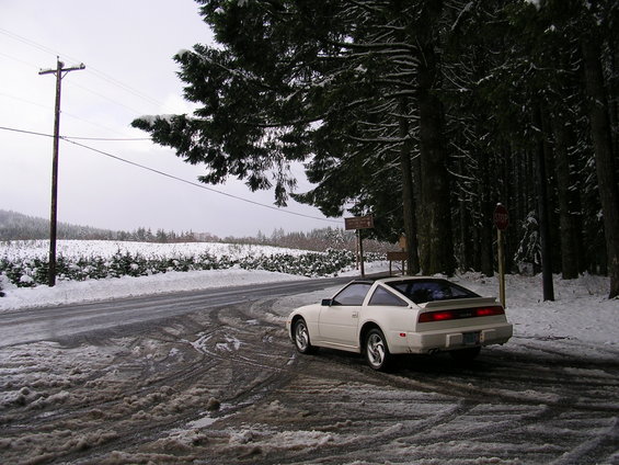 White 1989 Nissan 300ZX coupe with a t-top parked on a snowy road