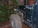 1994 Jeep YJ - This 1994 Jeep YJ shows its front fender removed, revealing the chassis and a large off-road tire.