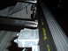 2003 Ford F-150 - Lund tonneau cover hardware installed in a truck bed, showing latch and rail components.