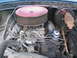 1977 Ford F-250 - Close-up of an engine bay, focusing on the carburetor and air cleaner assembly.
