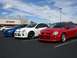 1996 Ford Probe - Three Dodge Neon SRT-4s are parked in a lot in front of a Target store.