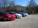 1996 Ford Probe - A line of four Dodge Neon SRT-4s are parked in a gravel lot under a clear blue sky.