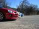 1996 Ford Probe - A line of Dodge Neon SRT-4s are parked in a gravel lot under a clear blue sky.