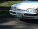 1987 Ford Mustang - The front of a white Ford Mustang is shown, a Washington license plate.