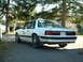 1987 Ford Mustang - A white 1987 Ford Mustang coupe is seen from a three-quarter front angle, parked outdoors.