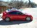 1996 Ford Probe - Side view of a red Dodge Neon SRT-4 with aftermarket wheels and a spoiler.