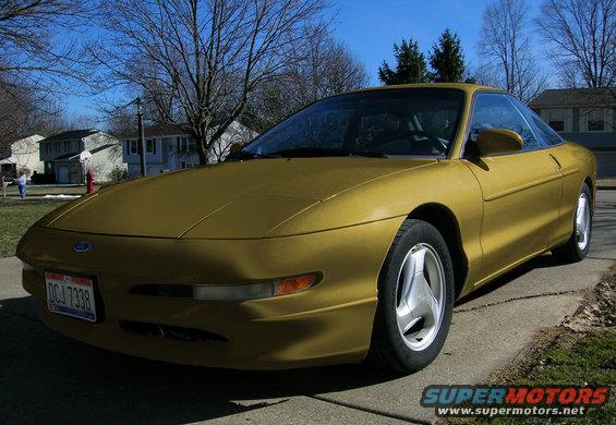 Gold 1997 Ford Probe front 3/4 view with license plate DCJ 7338