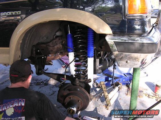 1988 Ford Bronco front suspension during lift install, showing new shocks and springs