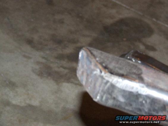 Metal rock slider with visible welds and a Supermotors.net watermark