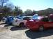 1996 Ford Probe - A line of Dodge Neon SRT-4s are parked with their hoods open, showing off their performance modifications.