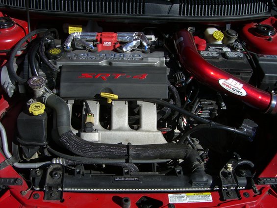 Dodge Neon SRT-4 engine bay with red AEM intake and SRT-4 engine cover