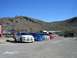 1996 Ford Probe - A group of Dodge Neon SRT-4s are lined up in a parking lot under a clear blue sky.