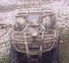 2005 Honda RANCHER - This ATV is heavily covered in mud, obscuring most details of its make and model.