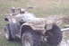 2005 Honda RANCHER - This 2005 Honda Rancher four-wheeler is heavily covered in mud, obscuring some details but not its model year.
