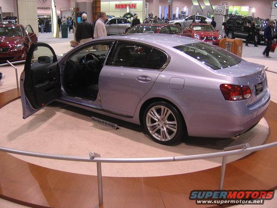 Light purple sedan with driver's door open on display